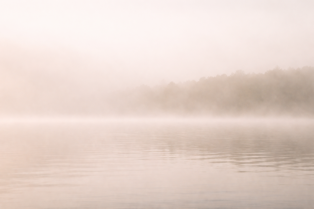 Misty lake with low visibility representing unclear and unseen grief (grief counselling blog Victoria BC)