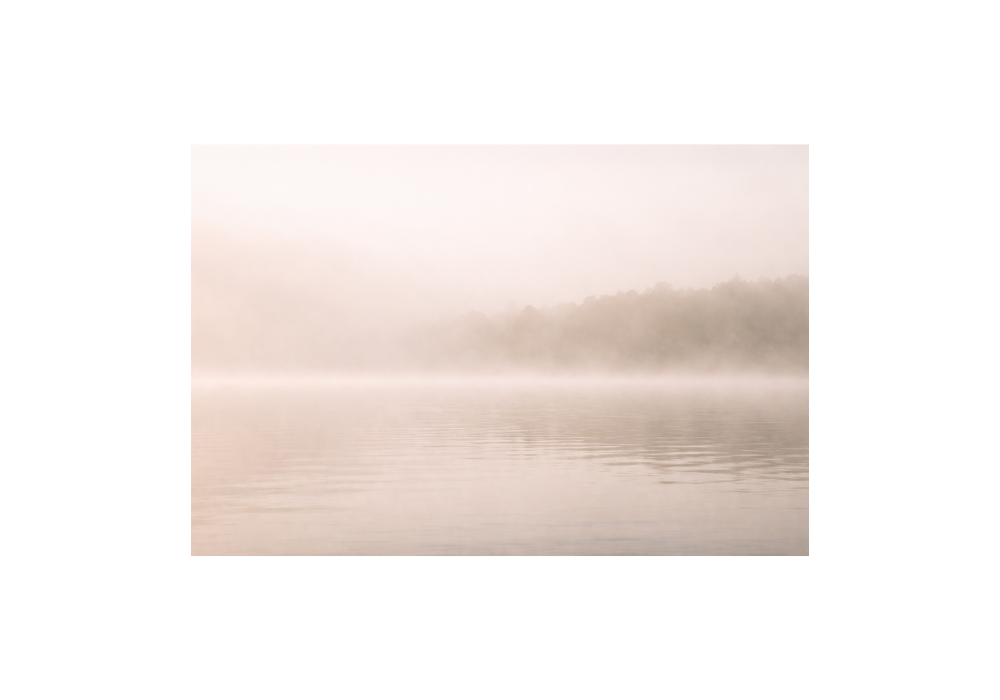 Misty lake with low visibility representing unclear and unseen grief (grief counselling blog Victoria BC)